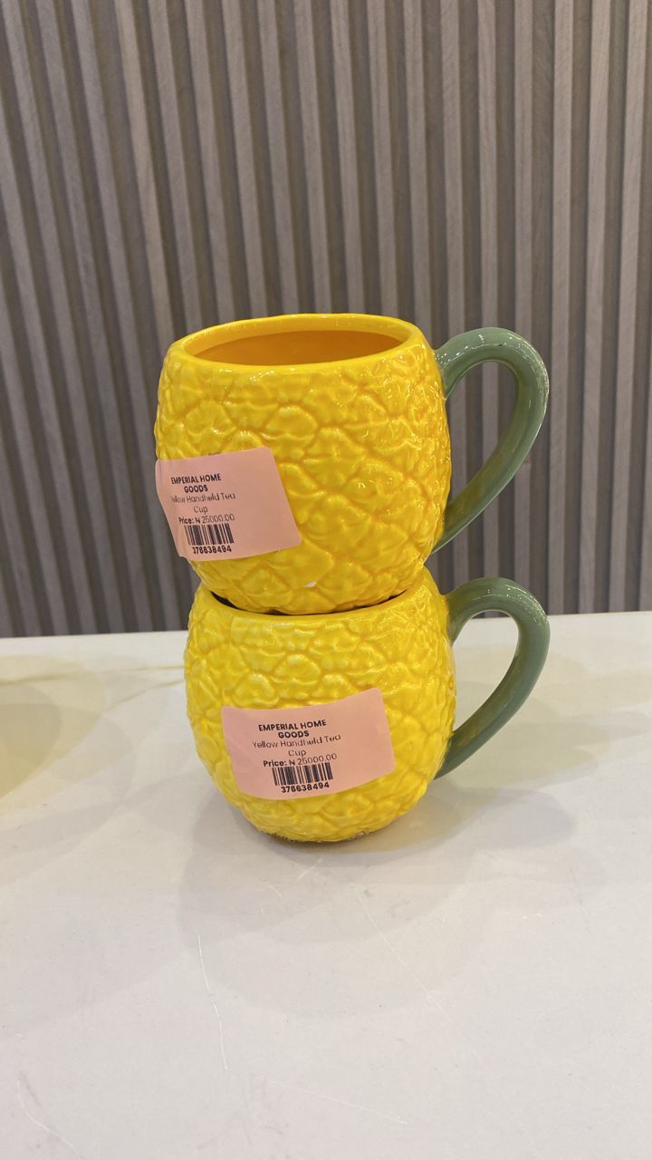 Yellow handheld tea cup